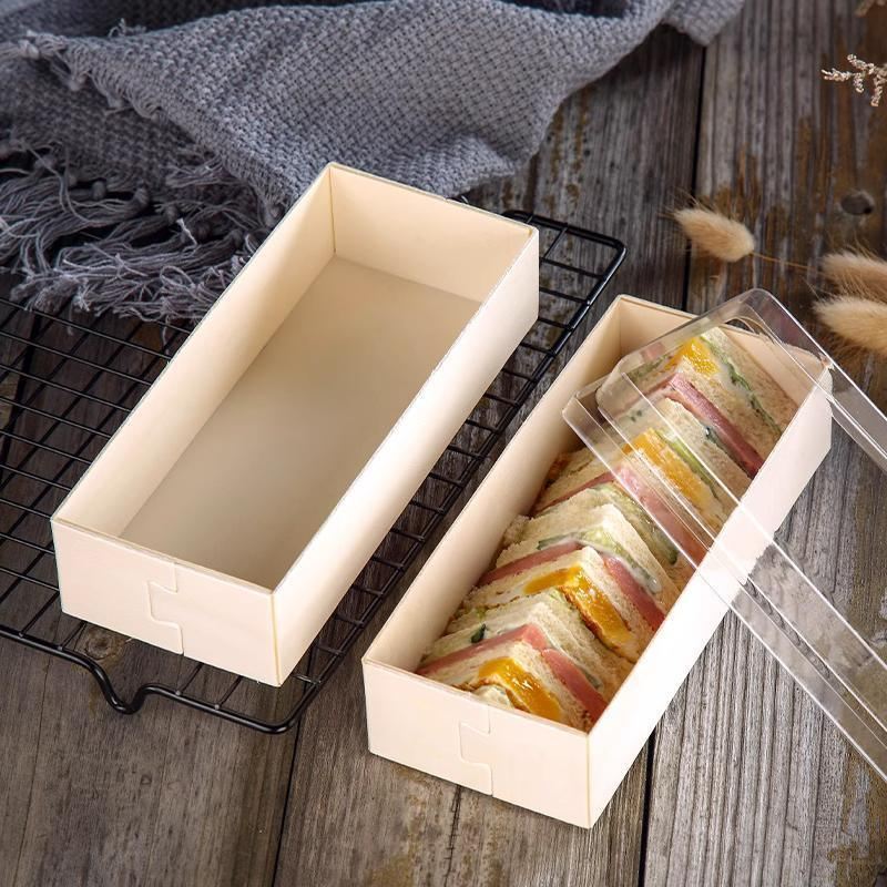 Cake containers with clear lids displaying a delicious cake inside