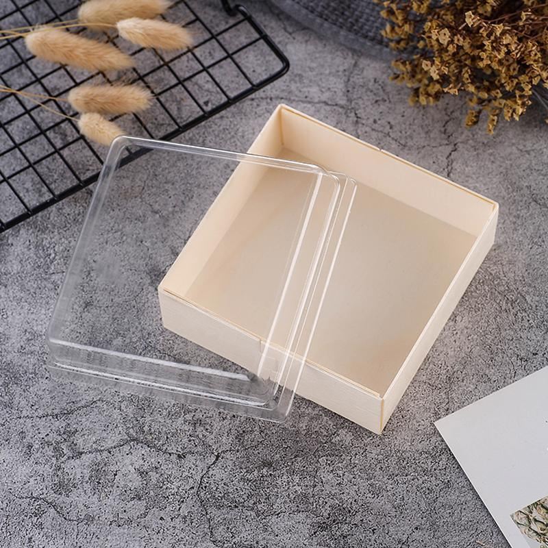 Cake containers with clear lids displaying a delicious cake inside