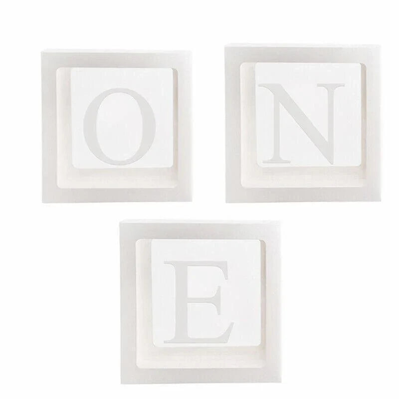 Clear balloon boxes filled with colorful balloons for party decor