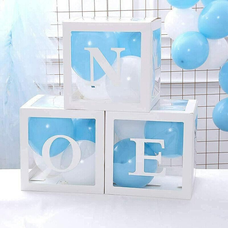 Clear balloon boxes filled with colorful balloons for party decor