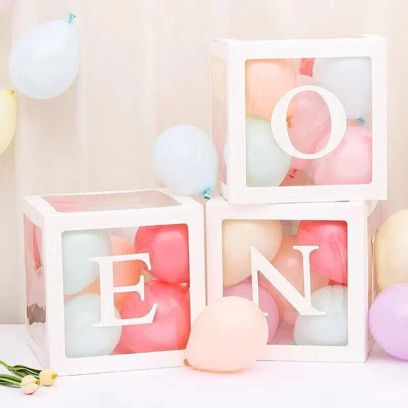 Clear balloon boxes filled with colorful balloons for party decor
