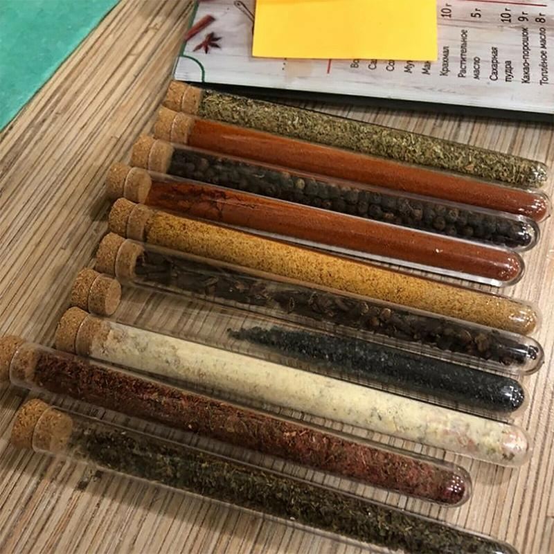 Variety of Test Tubes in a laboratory setting, filled with colorful liquids.
