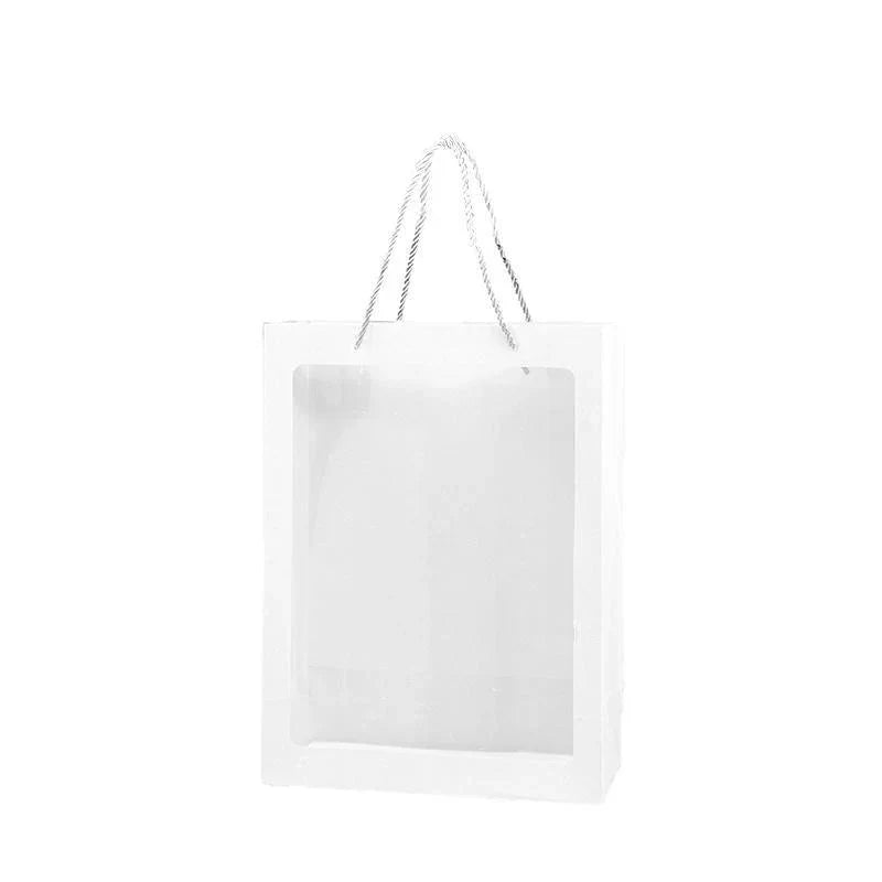 Elegant White Paper Bags lined up on a store counter, ready for customer purchases.