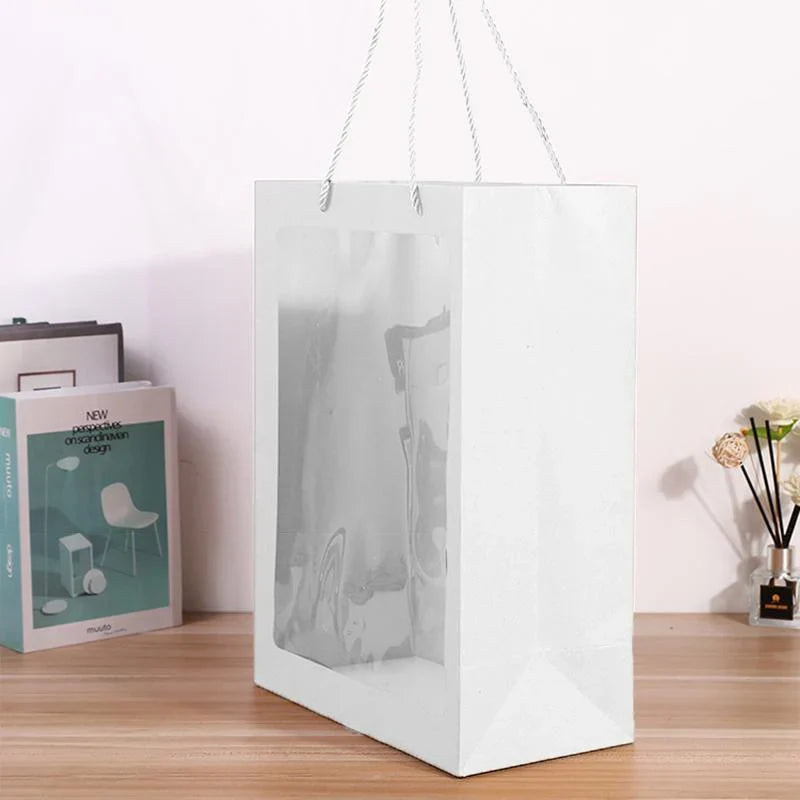 Elegant White Paper Bags lined up on a store counter, ready for customer purchases.