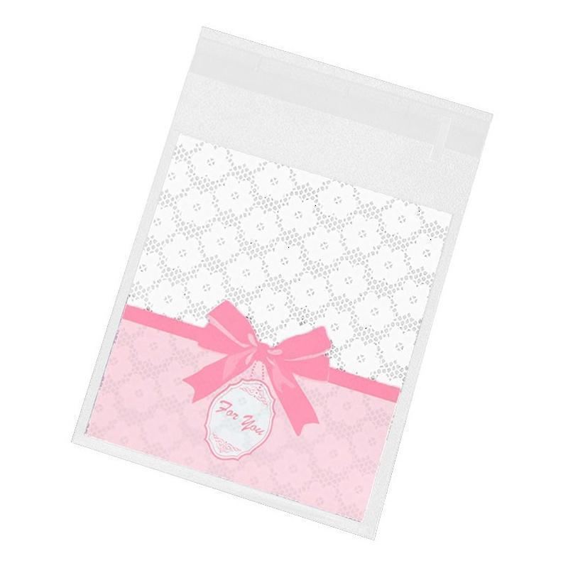 Assorted Christmas Gift Pouches decorated with festive ribbons and snowflakes