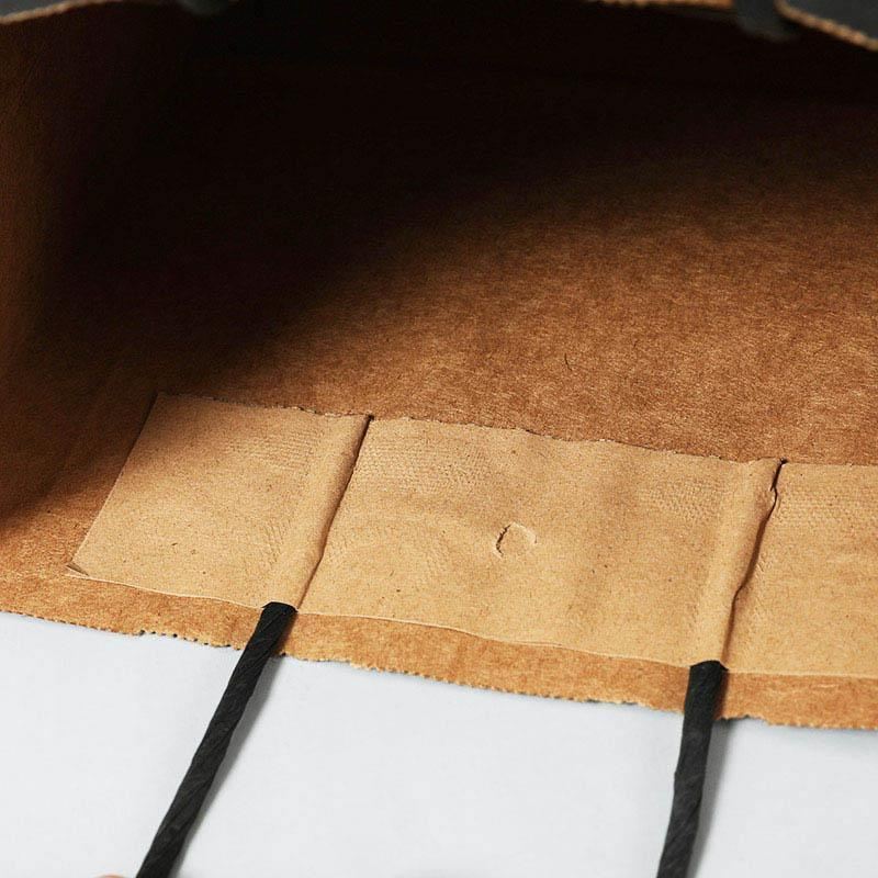 A selection of Paper Bags with Handles in various sizes on a store display