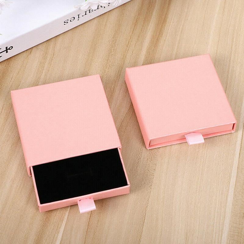 Elegant Jewelry Box Case open on a dresser with various jewelry compartments