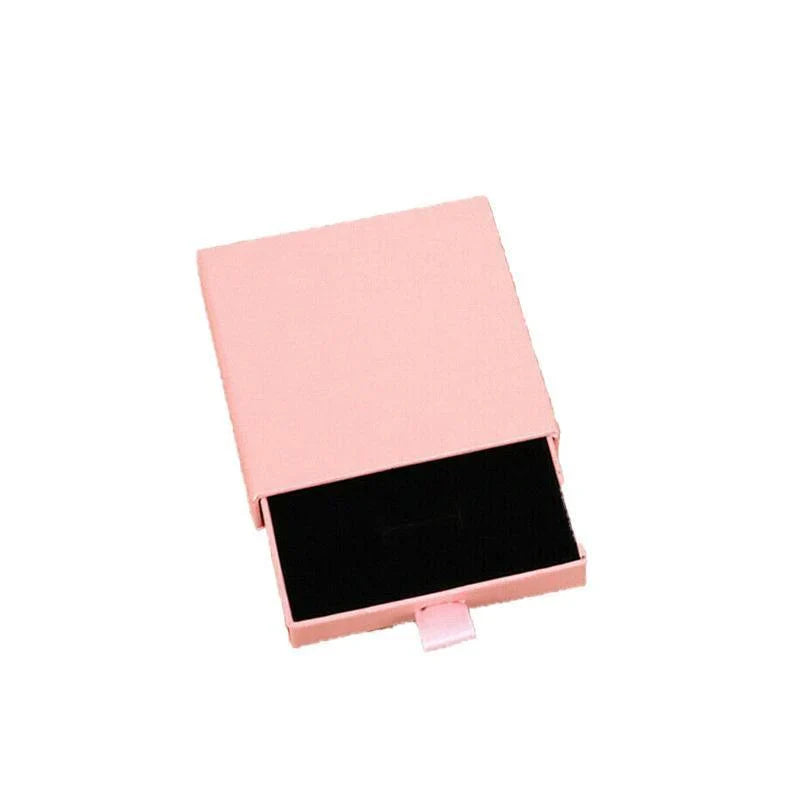 Elegant Jewelry Box Case open on a dresser with various jewelry compartments