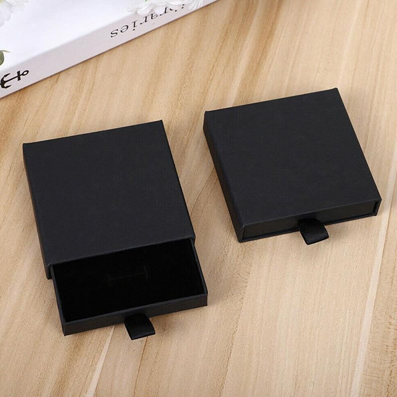 Elegant Jewelry Box Case open on a dresser with various jewelry compartments