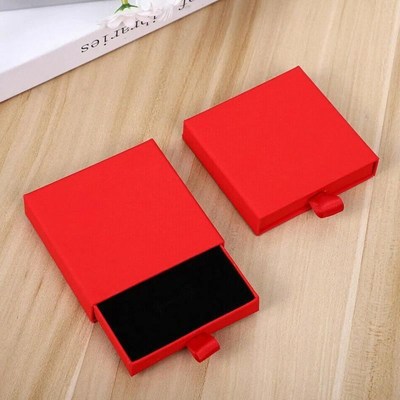 Elegant Jewelry Box Case open on a dresser with various jewelry compartments