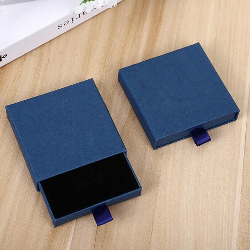 Elegant Jewelry Box Case open on a dresser with various jewelry compartments