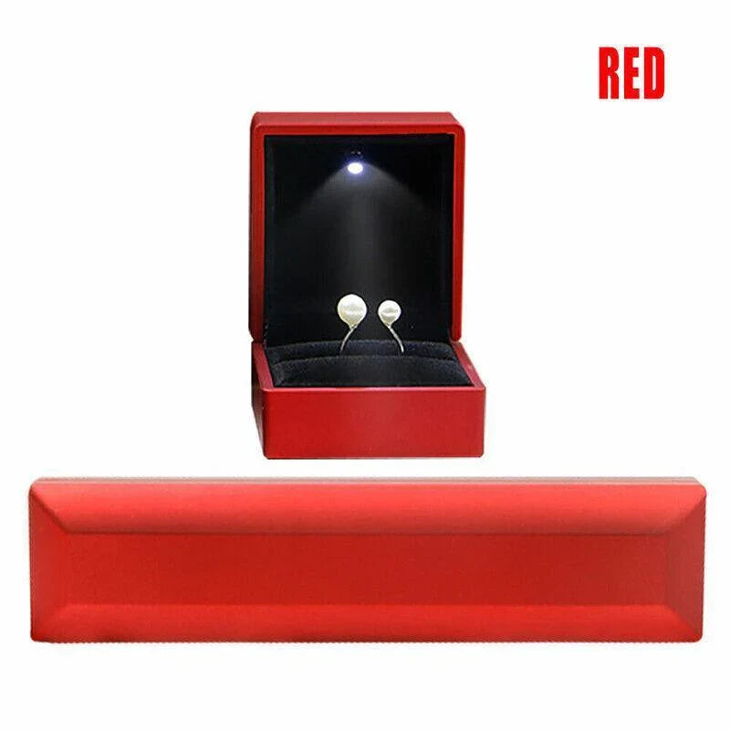 Elegant LED Jewelry Case open, displaying illuminated necklaces and rings.