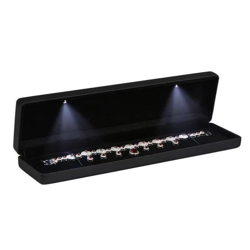 Elegant LED Jewelry Case open, displaying illuminated necklaces and rings.