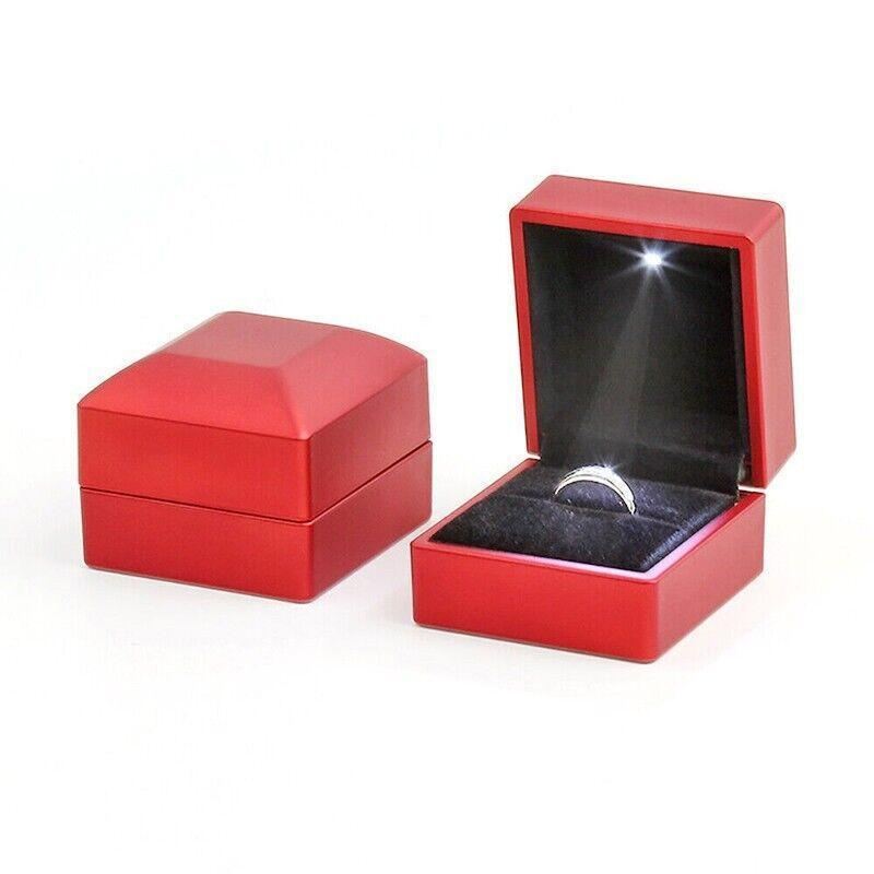 Elegant LED Jewelry Case open, displaying illuminated necklaces and rings.