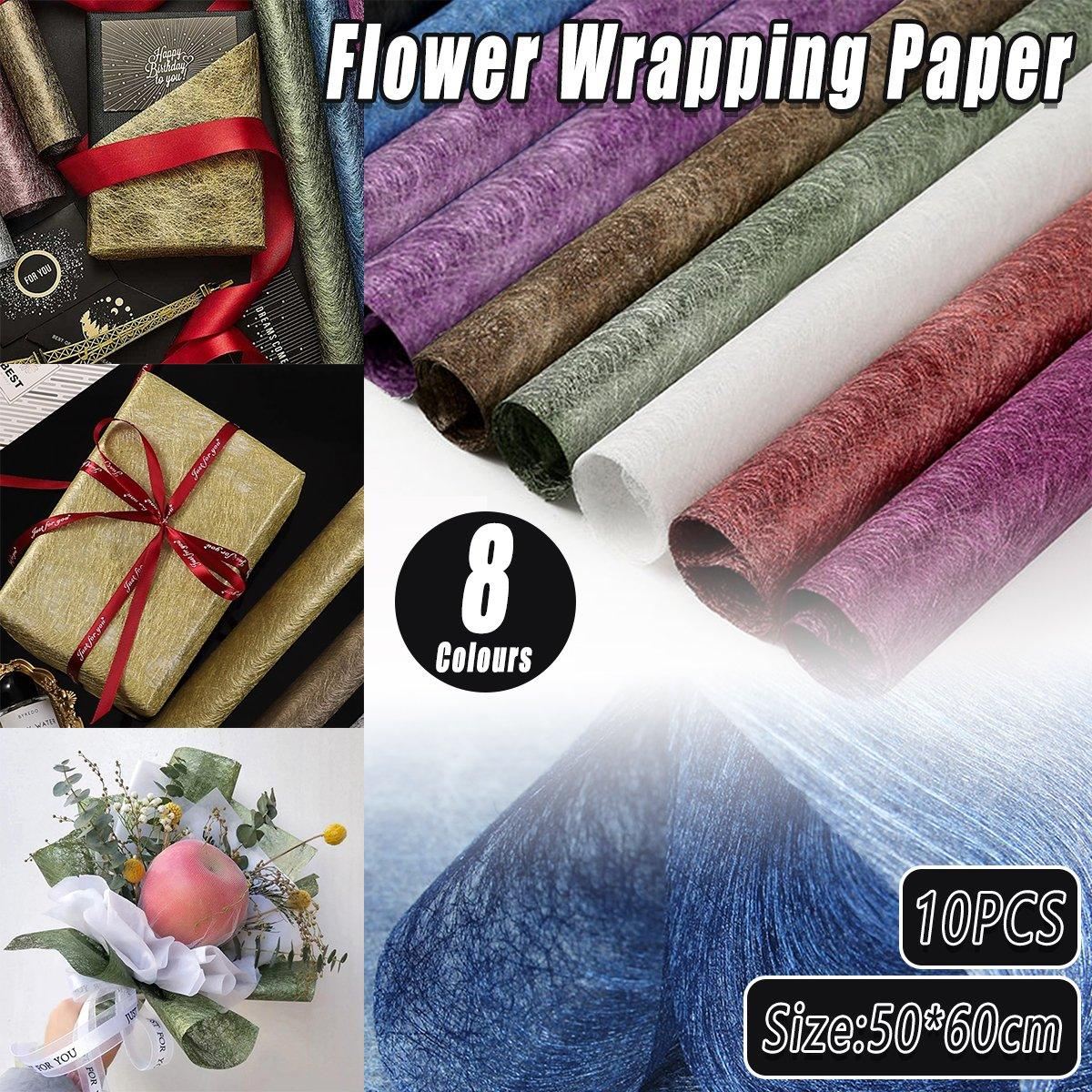 A selection of fabric sheets in various colors, including pink, white, brown, and blue.