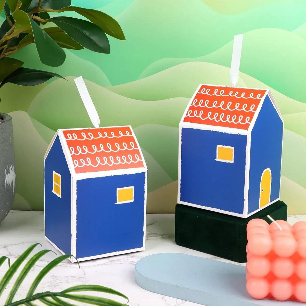 Add a touch of whimsy and colour to your next event with these charming small house gift boxes.