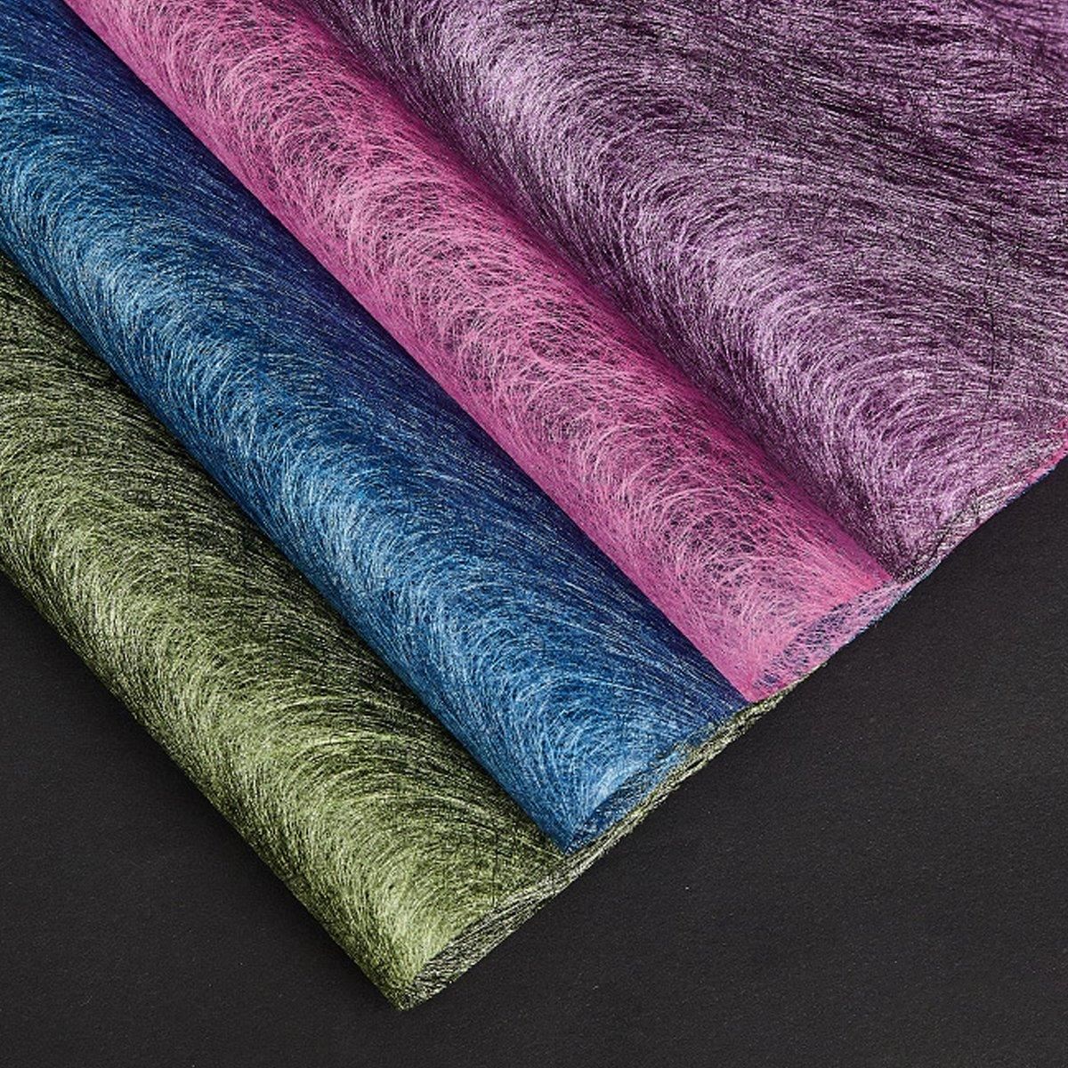 A selection of fabric sheets in various colors, including pink, white, brown, and blue.