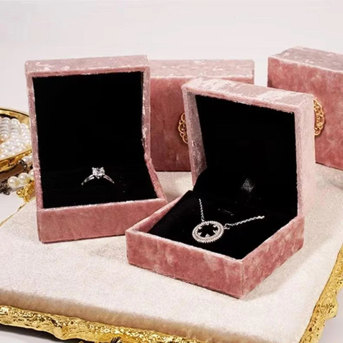 Add a touch of vintage elegance to your jewelry presentation with this 5-Piece Set of Pink Velvet Jewelry Boxes.
