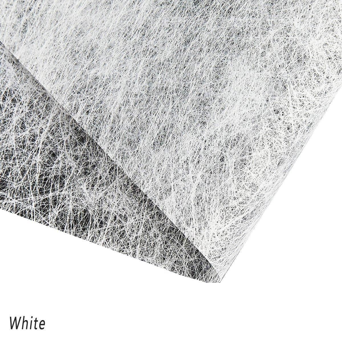 A selection of fabric sheets in various colors, including pink, white, brown, and blue.
