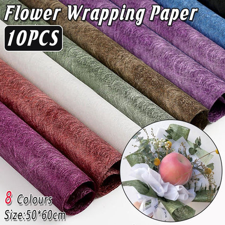 A selection of fabric sheets in various colors, including pink, white, brown, and blue.