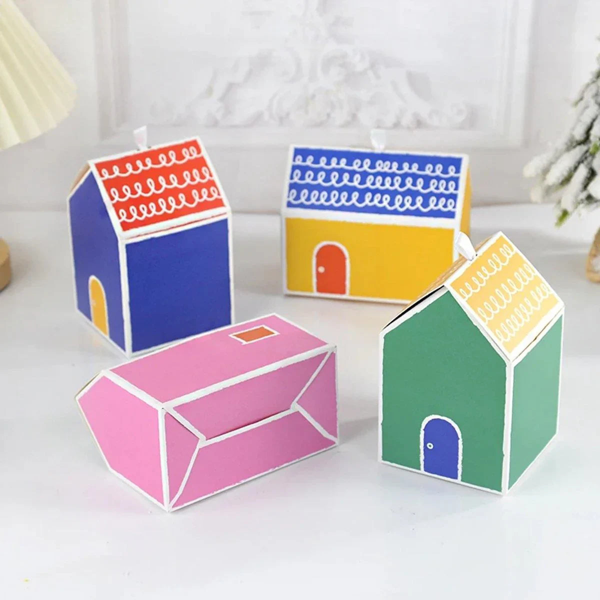 Add a touch of whimsy and colour to your next event with these charming small house gift boxes.