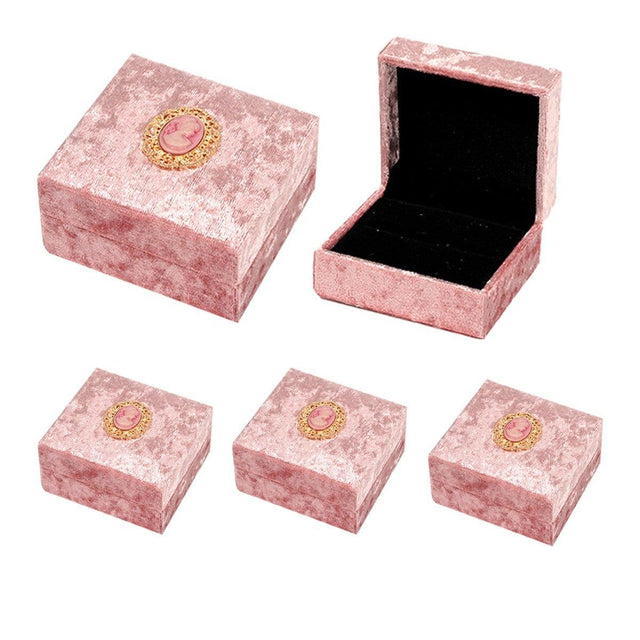 Add a touch of vintage elegance to your jewelry presentation with this 5-Piece Set of Pink Velvet Jewelry Boxes.