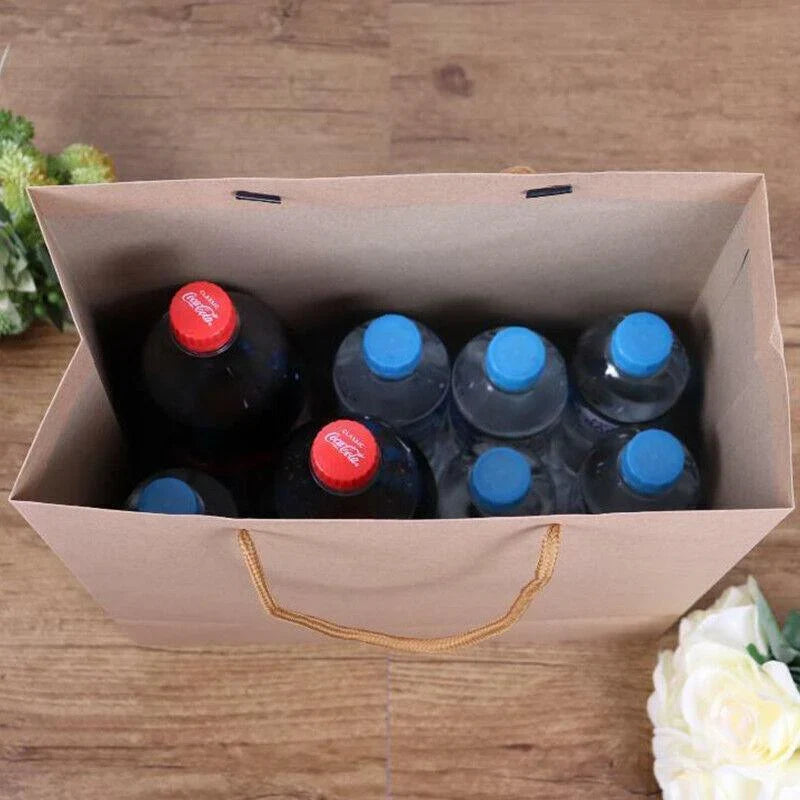 A collection of natural brown kraft paper bags with twisted paper handles, ready for versatile use.