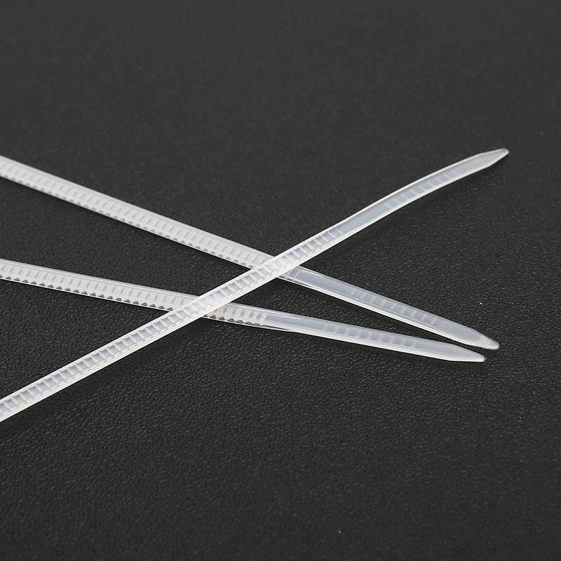 An array of neatly organized cables secured with white wire ties, enhancing both functionality and aesthetics.