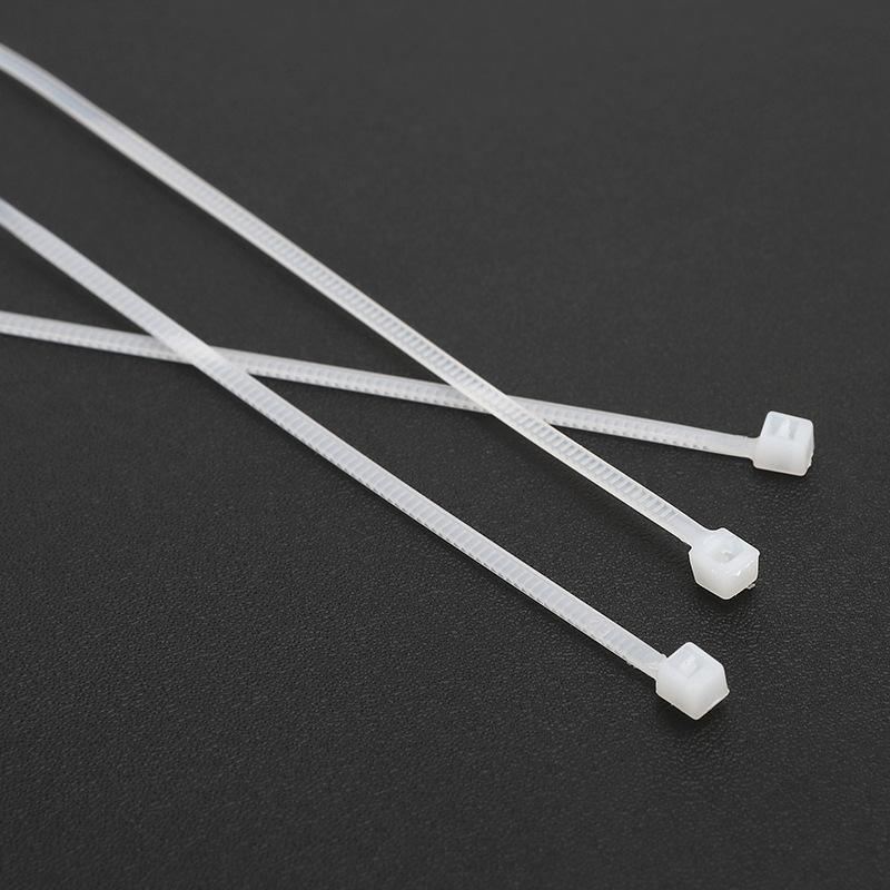 An array of neatly organized cables secured with white wire ties, enhancing both functionality and aesthetics.