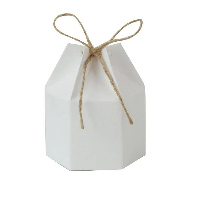 Assorted sizes of Kraft Paper Gift Boxes stacked on a wooden table