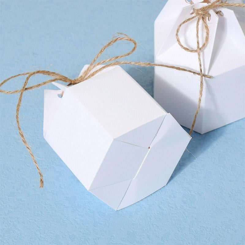 Assorted sizes of Kraft Paper Gift Boxes stacked on a wooden table
