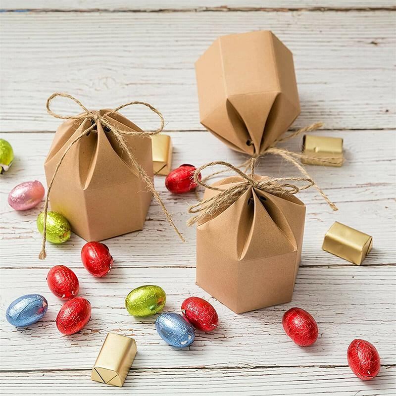 Assorted sizes of Kraft Paper Gift Boxes stacked on a wooden table
