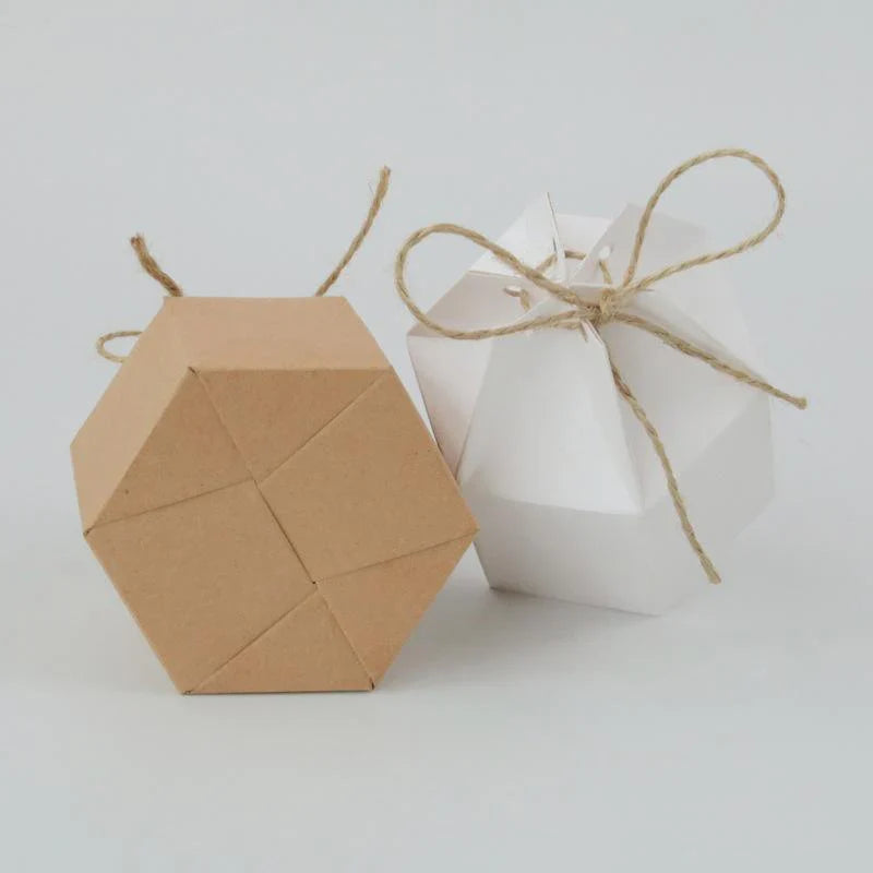 Assorted sizes of Kraft Paper Gift Boxes stacked on a wooden table