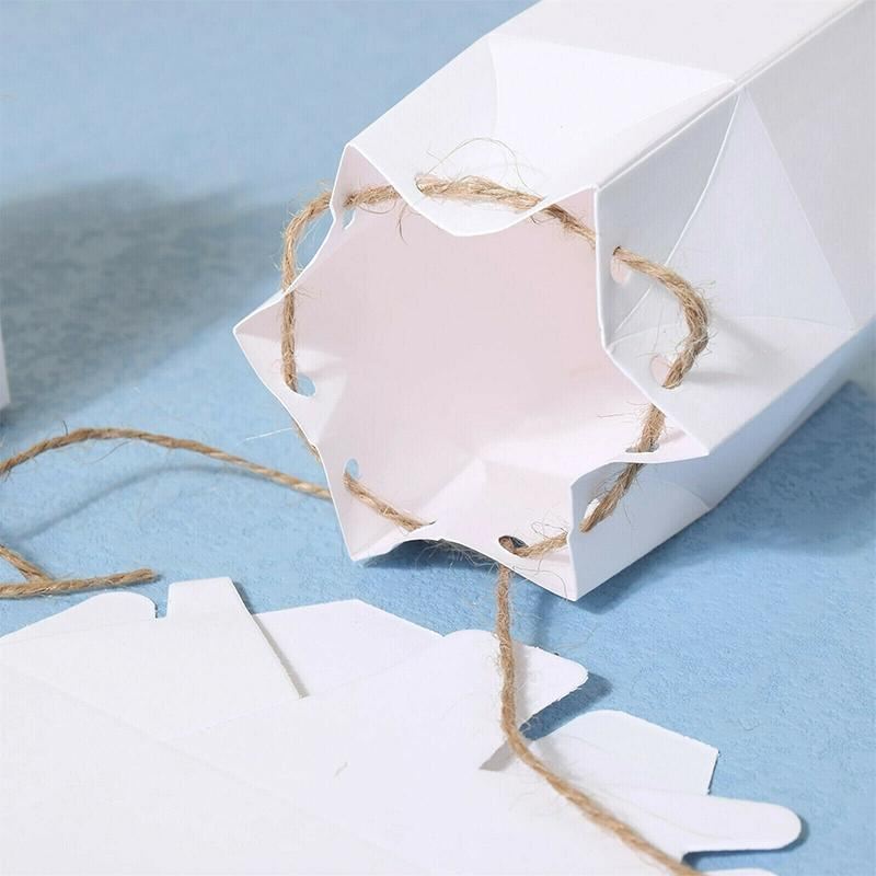Assorted sizes of Kraft Paper Gift Boxes stacked on a wooden table