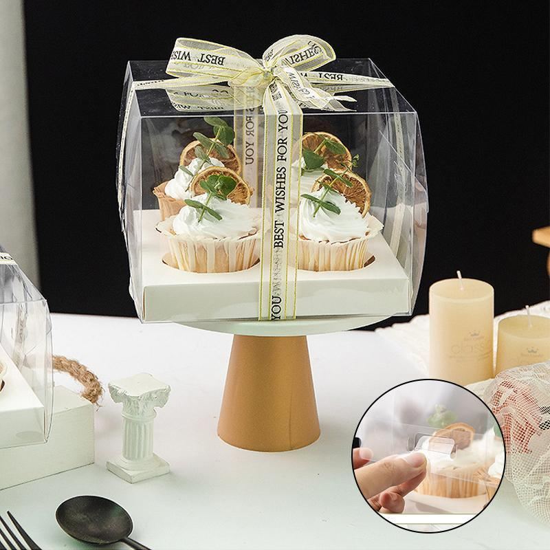 Clear cupcake box showcasing beautifully decorated cupcakes.