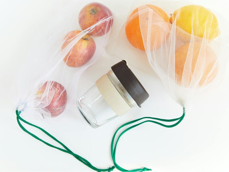 PE Fruit Protection bags filled with apples and oranges