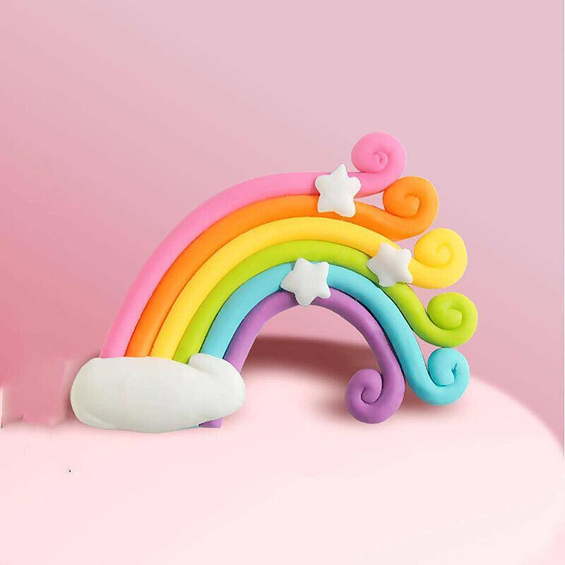 Whimsical unicorn cake topper with rainbow mane and golden horn