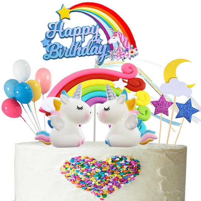 Whimsical unicorn cake topper with rainbow mane and golden horn