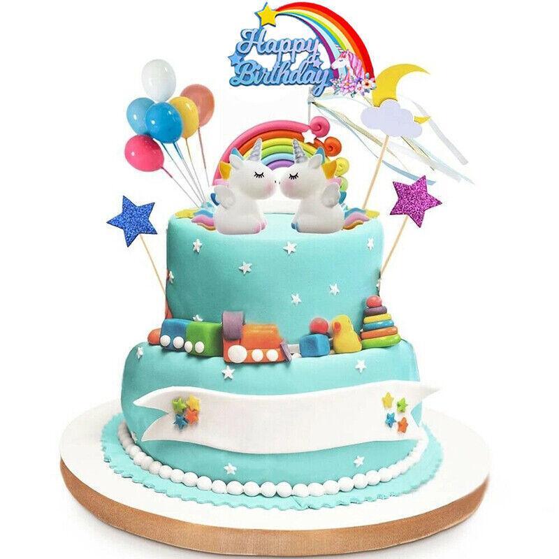 Whimsical unicorn cake topper with rainbow mane and golden horn