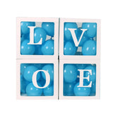 Clear balloon boxes filled with colorful balloons for party decor