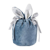 A collection of colorful Easter gift bags filled with holiday treats and goodies.