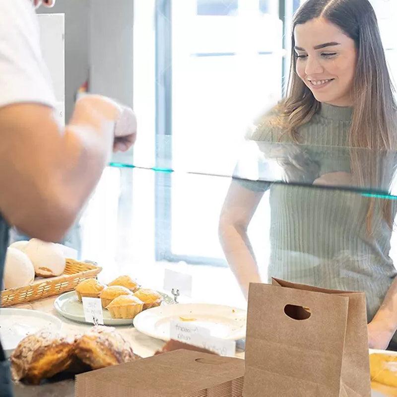 Paper grocery bags filled with fresh produce