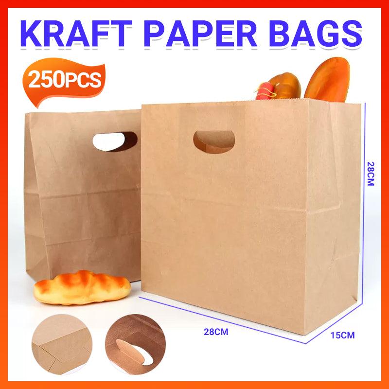 Paper grocery bags filled with fresh produce