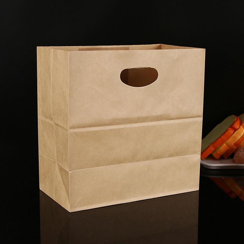 Paper grocery bags filled with fresh produce