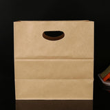 Paper grocery bags filled with fresh produce