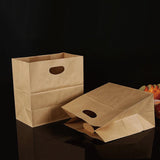 Paper grocery bags filled with fresh produce