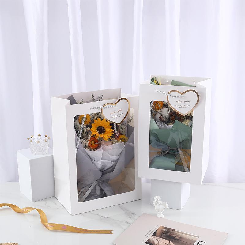 Elegant White Paper Bags lined up on a store counter, ready for customer purchases.