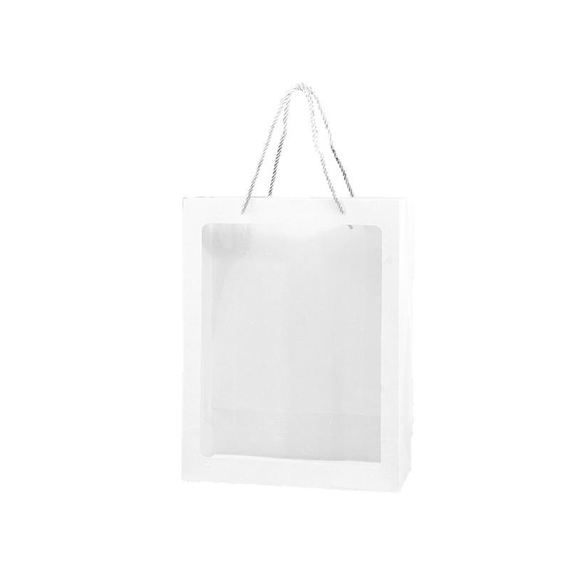 Elegant White Paper Bags lined up on a store counter, ready for customer purchases.