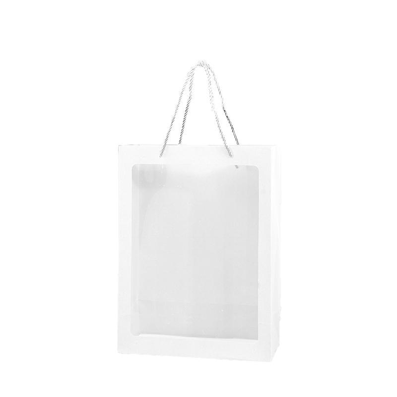 Elegant White Paper Bags lined up on a store counter, ready for customer purchases.