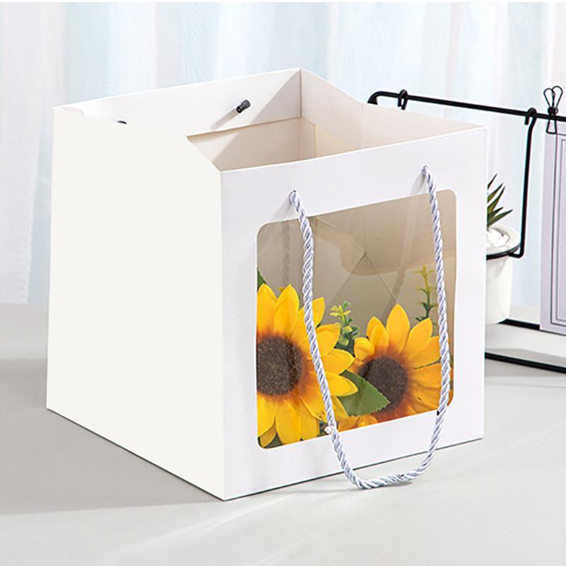 Elegant White Paper Bags lined up on a store counter, ready for customer purchases.